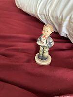 Front view of Goebel Hummel choir boy figurine