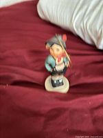 Front view of porcelain boy figurine ornament