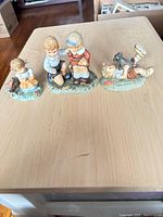 Front view of all three figurines on table