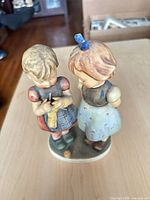 front view of Hummel Goebel figurine showing two children on oval base
