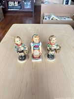 Front view of all three figurines