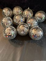 Group shot showing all ten mirrored disco balls