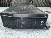 Front view showing APC logo, buttons and USB port