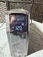 Front view showing LCD display lit at 120V output and battery bar