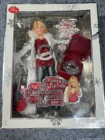 Front of sealed box showing doll and accessories