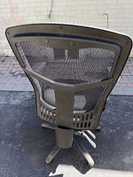 Rear view showing full mesh backrest and lumbar support structure