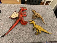 All three figures on tabletop showing scale and condition