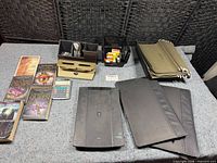 All items displayed on surface: books, calculator, organizers, glue sticks basket, padfolios, expanding files