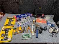 Wide view of all tools and hardware laid on table