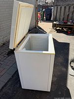 Chest freezer open showing interior