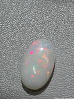 Top view of Ethiopian opal showing red and orange play-of-colour