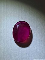 Front view of faceted oval ruby