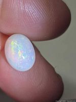 Front view showing overall play-of-colour of opal