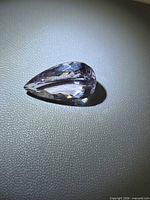 Top view of pear-shaped light pink amethyst showing overall shape and facet pattern