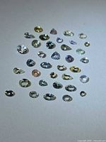 All stones spread out to show variety of cuts and colours