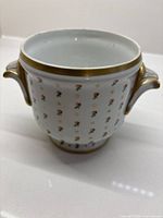 Front view showing rosebud pattern and handle