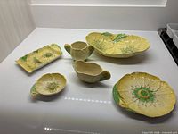 All six Carlton Ware Buttercup pieces arranged on countertop