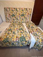 Headboard on bed with two curtain panels displayed