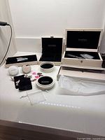 Assortment of Pandora jewelry storage items on countertop