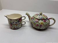Mini teapot, cup stacked with creamer