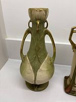 Amphora vase rear/side showing handles and leaf motif