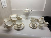 Full group: teapot, tea cups with saucers, espresso cups with saucers