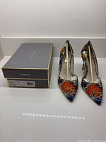 Shoes with box, side view showing pattern and heel height