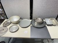 Group shot showing colander, pizza pans, sieves, loaf pans, silicone mat