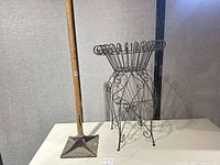Wire plant stand next to Olympia tamper full view