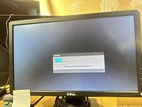 Front view of Dell E1914H monitor powered on showing message