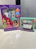 Front view of both Disney Princess activity kit and Stitch canvas set