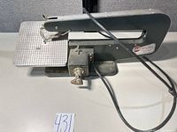 Full view of Dremel scroll saw with work table, blade, power cord
