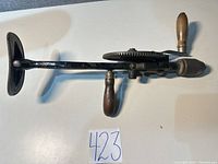 Full side view of Goodell-Pratt No. 245 hand drill showing overall form, handles and chuck