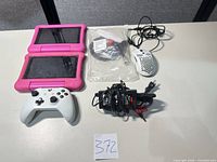 Lot overview: two tablets, controller, mouse, lock, cables