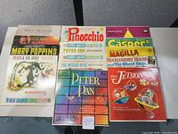 Overview of 9 album covers including Pinocchio, Casper, The Jetsons, Peter Pan, Wizard of Oz, etc.