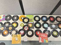 Full lot of singles laid out on table showing quantity and variety