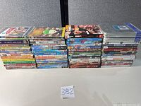 All 57 DVDs stacked in three columns showing spines