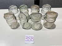 Front view of all eight jars showing brands and colors