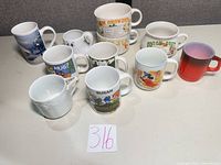 Group shot of all eleven mugs laid out on table