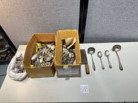 Overall lot in boxes with flatware, cleaver and selected pieces displayed