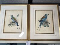 Both framed lithographs side by side