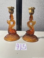Front view of both amber koi fish candlesticks