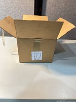 Outer cardboard shipping box open