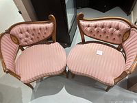 Top view of both chairs showing upholstery, tufting, wood frames