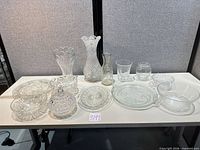 All 13 glass and crystal pieces displayed on table