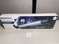 Front of retail box showing telescope image and branding