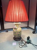 Lamp lit showing complete form, shade, base and cord