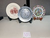 Front view of all three commemorative plates