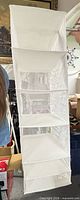 Full view of 5-shelf white fabric hanging organizer