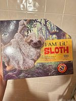 Front of I Am Lil' Sloth puzzle box showing image and title
